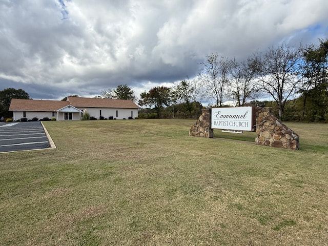 Emmanuel Baptist Church building and stone sign on Chisholm Road in Florence, Alabama